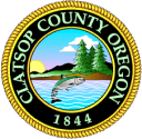 Clatsop County logo is circle with drawing of fish jumping from a lake, trees, mountains and sun in background.